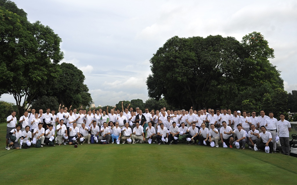 The Green Tee participants sport their tournament shirts and prepare to enjoy a perfect golf day together.
